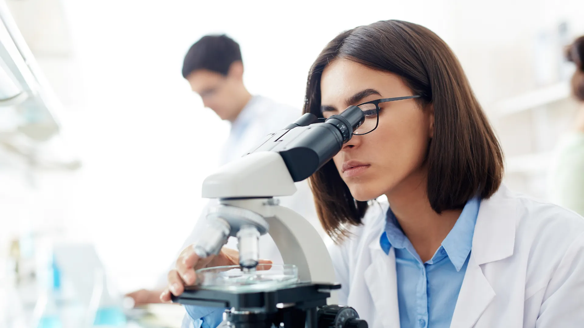 Scientist examining a sample in the lab